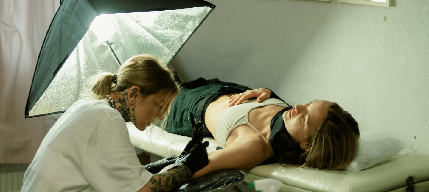 Woman getting a tattoo by a woman artist