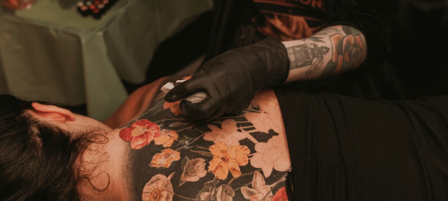 Pamela Carvalho Tattooing Back Piece of Flowers