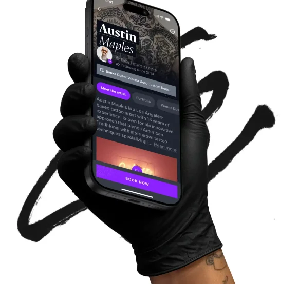 The CO:CREATE app held in a black-gloved hand