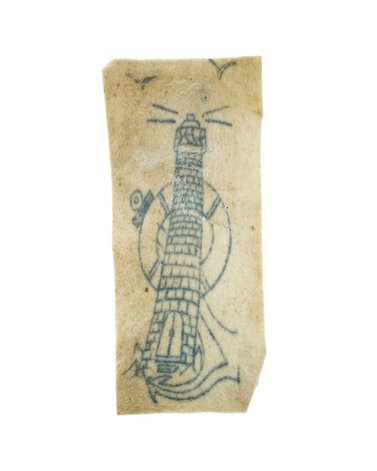 Tattoo of an anchor and lighthouse on skin