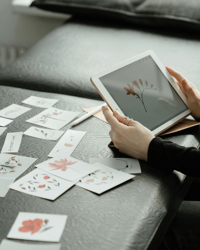 Tattoo Artist Creating Design on tablet