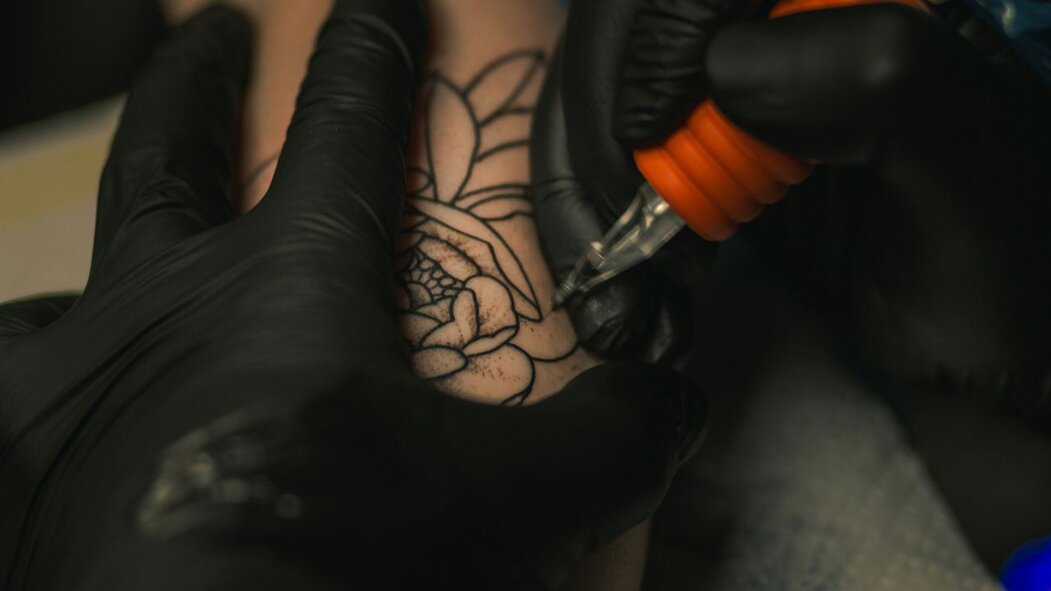 Tattoo Artist making a tattoo
