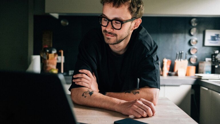 Tattoo Artist using laptop