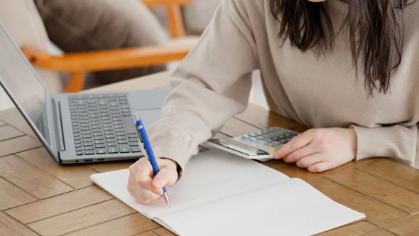 A women calculating child support payments