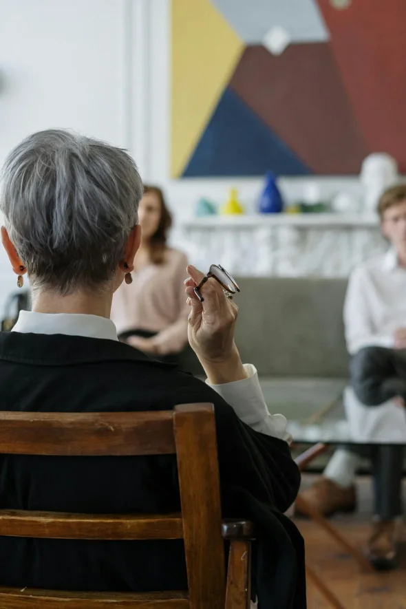 A lawyer having a consultation meeting with a couple considering divorce. 