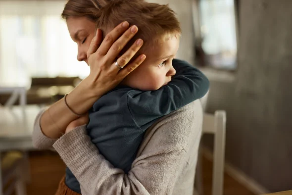 A mother hugging her child