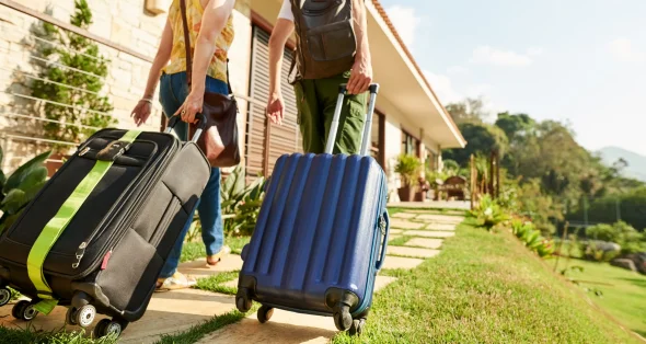 A couple traveling with suitcases