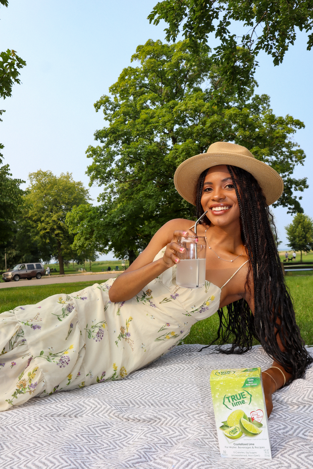 woman drinking true lemon in the park