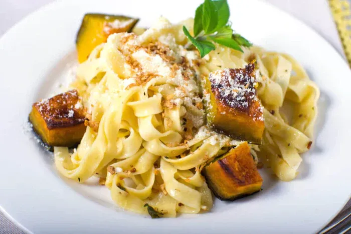 A bowl of True Lemon Fall Squash Baked Pappardelle.