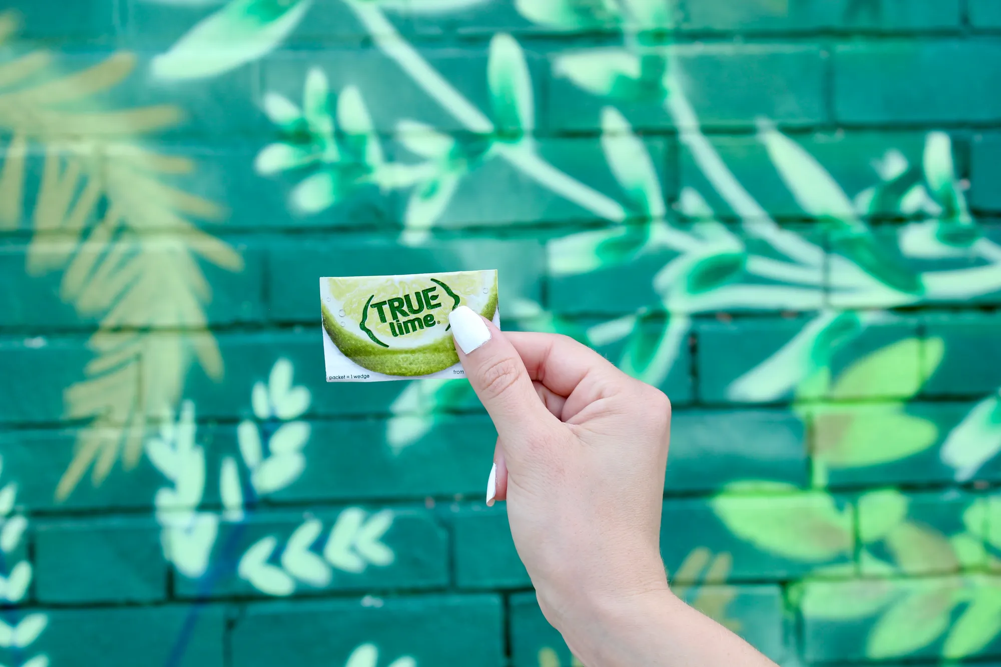 A graphic of a box of True Lime, True Lime Black Cherry Limeade, and True Lime Watermelon Limeade.