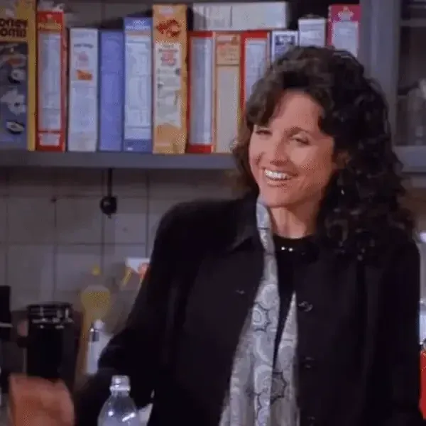 A gif of a woman smiling and tousling her hair with the caption "Oh, come on."