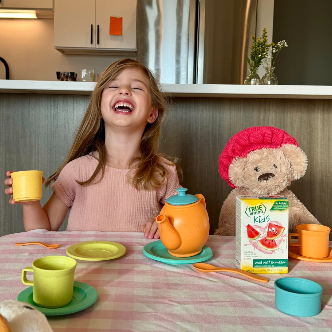 Young girl having a tea party with True Lemon Kids