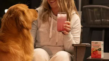 Woman With Dog Drinking True Lemon Strawberry Lemonade