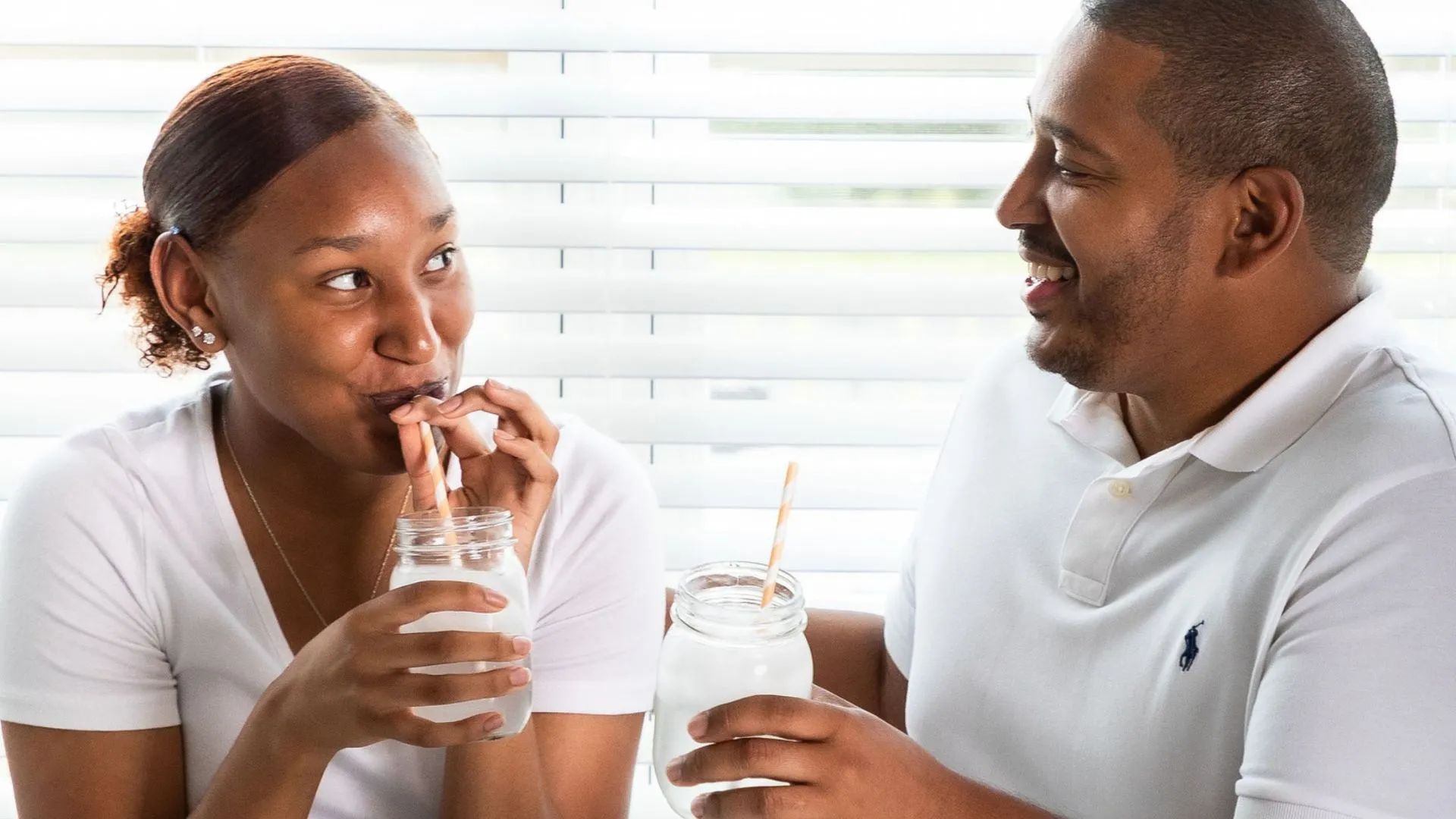 Couple Drinking Coconut Water Mocktails Indoors