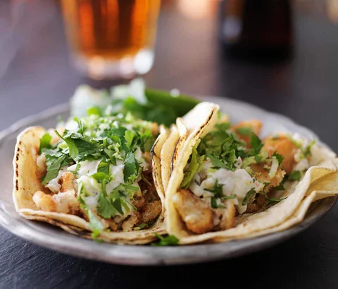 Fish tacos on a plate.