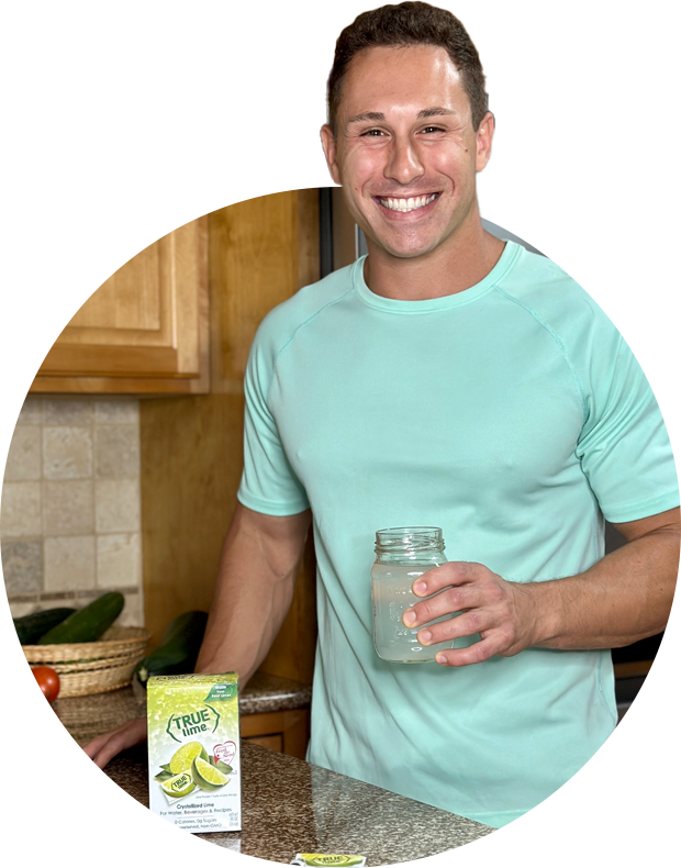 man smiling in his kitchen with True Lime