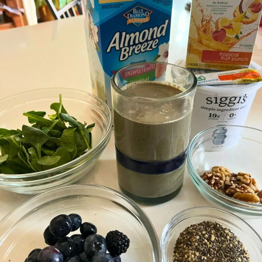 Smoothie with spinach, almond milk, True Lemon Energy, walnuts, chia seeds and blueberries
