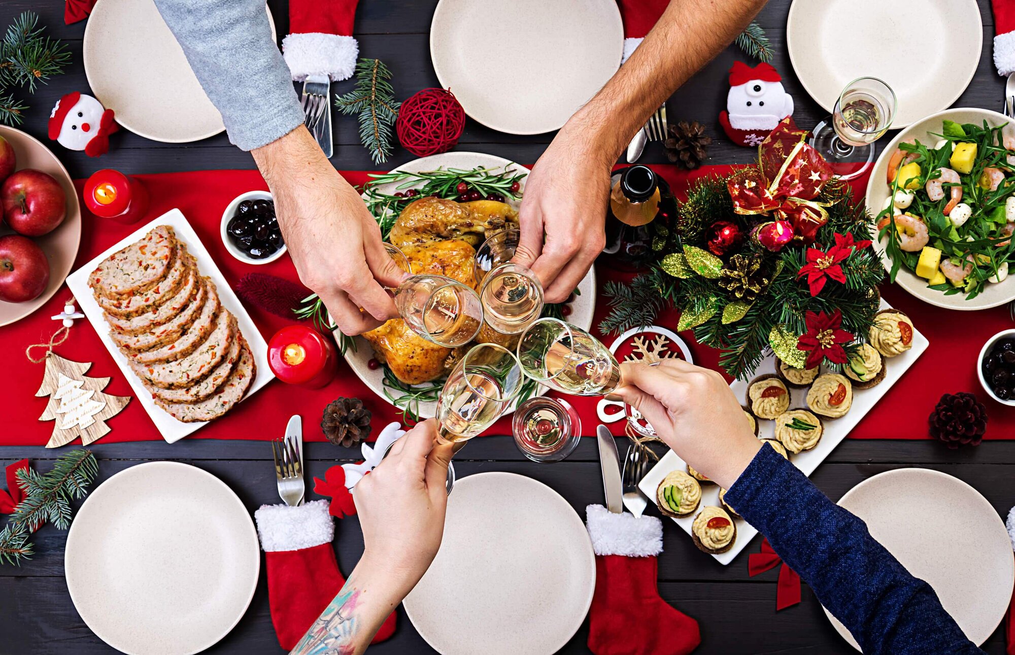 A holiday table with festive decorations and a spread of simple, colorful dishes perfect for a stress-free celebration