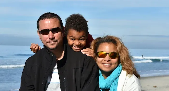 Photo of Kauilani Goodwyn and her family at the beach
