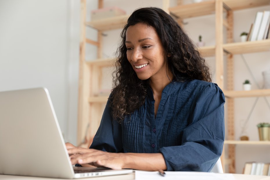 image of a woman working on a laptop