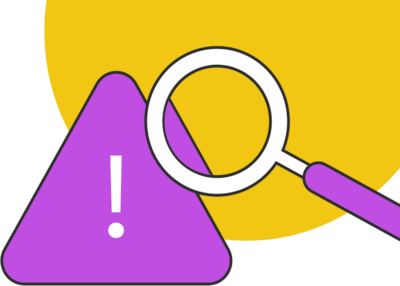 magnifying glass hovering over a caution sign