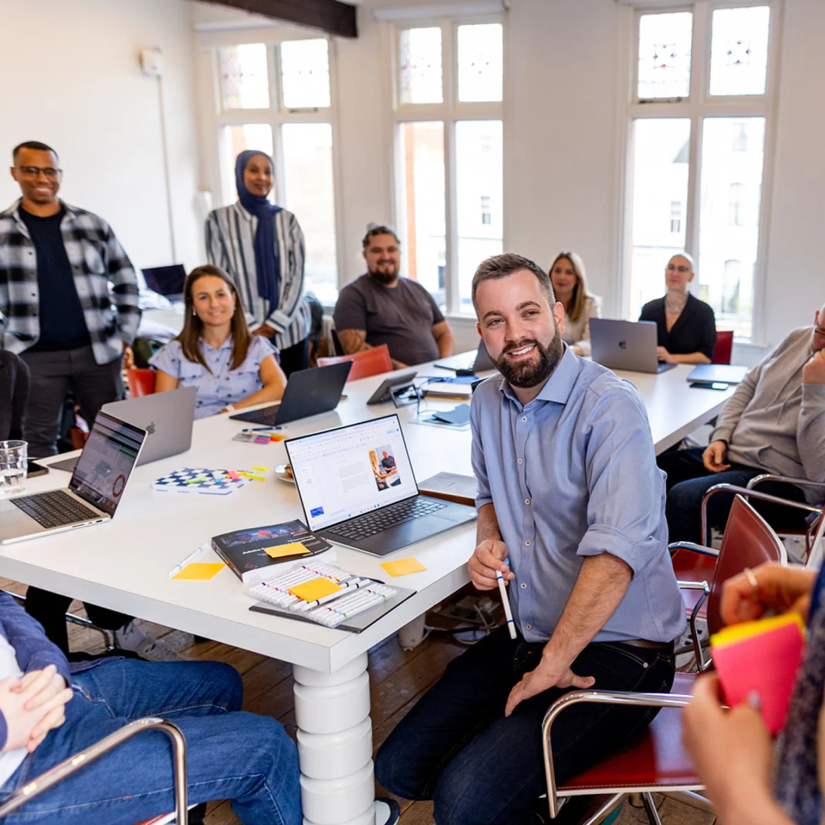 Develo team collaborating in our UK office during a strategy meeting