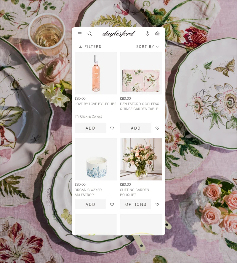 Daylesford mobile app product page with elegant table setting and organic wine selection