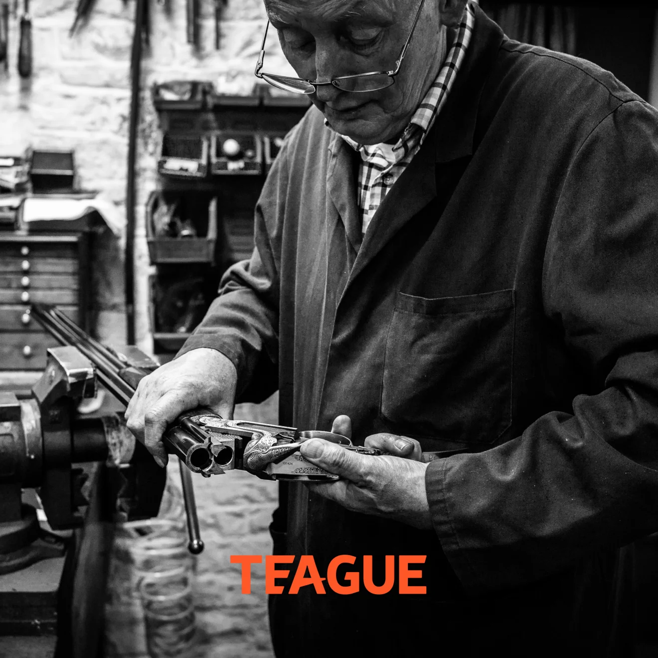 Teague craftsman inspecting precision-engineered shotgun chokes demonstrating manufacturing expertise