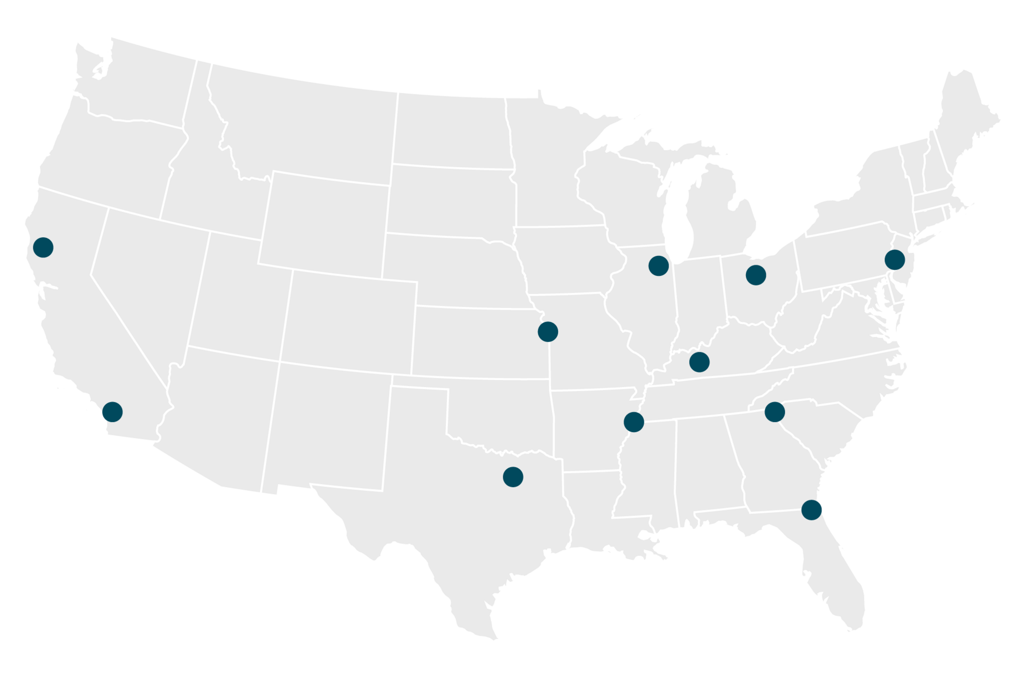 industrial materials and supplies in stacked boxes on dolly being carted through a warehouse by employee