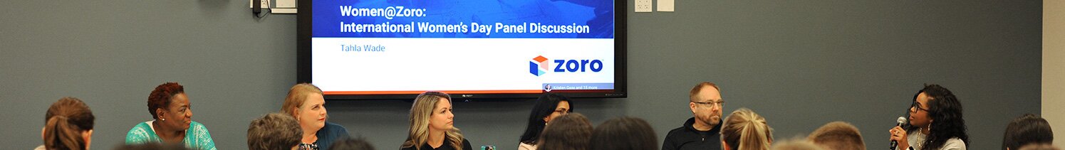 A group of employees sitting around a conference table