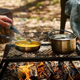 Mac and cheese prepared over a camp fire in the campfire cooking kit.