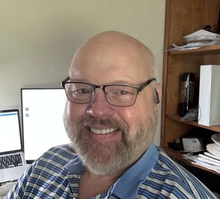 A 4Patriots 3-Month Survival Food Kit is placed outdoors near a growing garden.