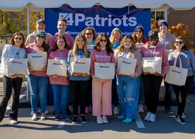 A man with his Patriot Power Solar Generator 2200X and 2 Free Solar Panels