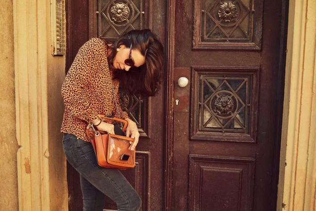Renter checking a lease before changing or replacing an apartment lock