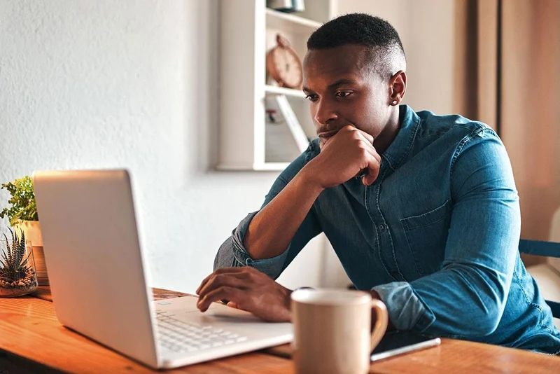 Renter reviewing a lease renewal offer on a laptop