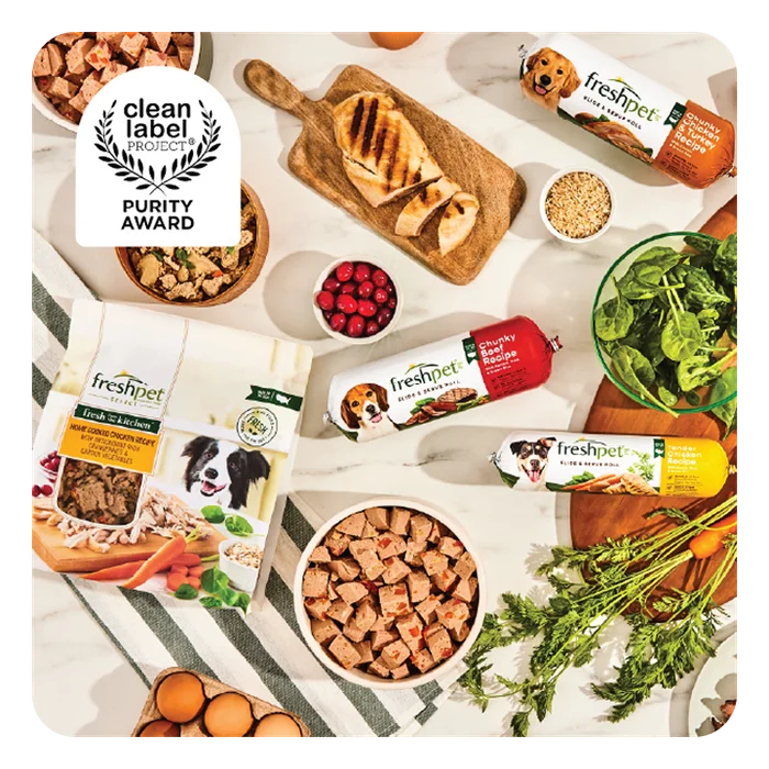 Freshpet products on a table with fresh ingredients