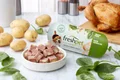 Freshpet grain free chicken recipe with potato & spinach on a kitchen table