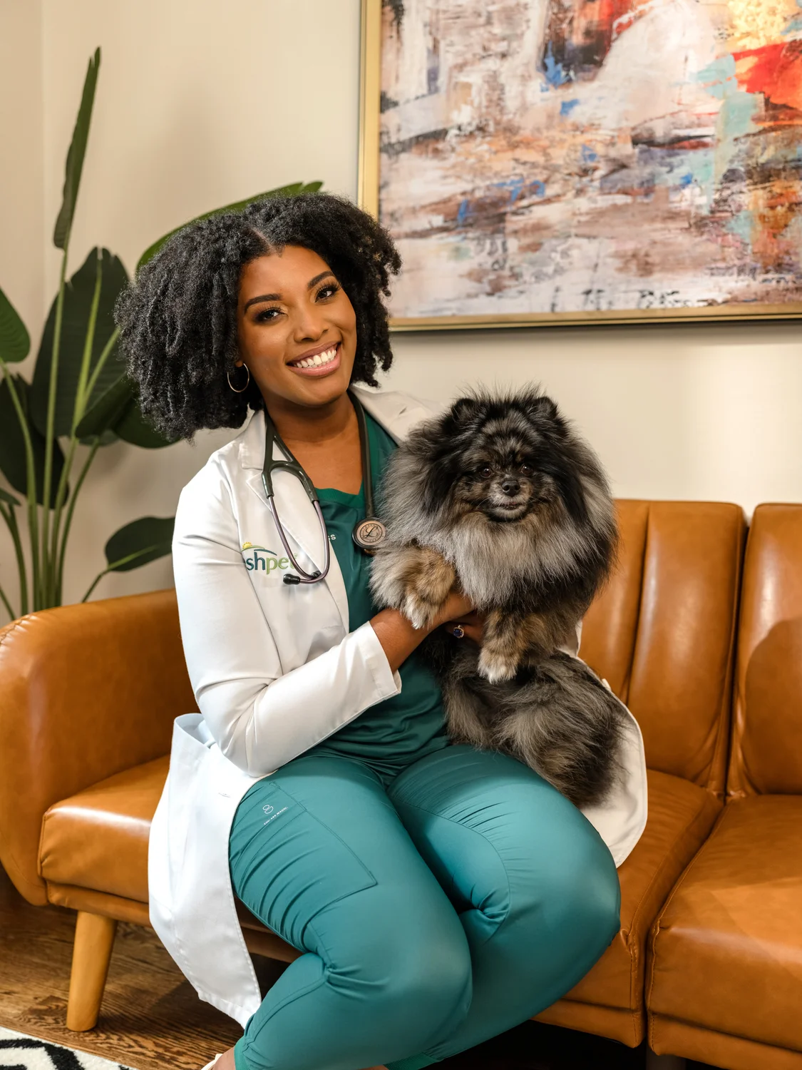 Veterinarian holding a chow-chow