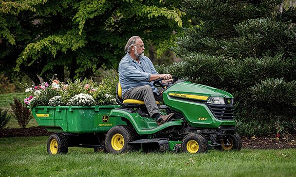 Man cutting grass with lawn mow