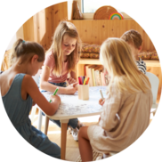 Mother and child sitting at the dining room table with flowers