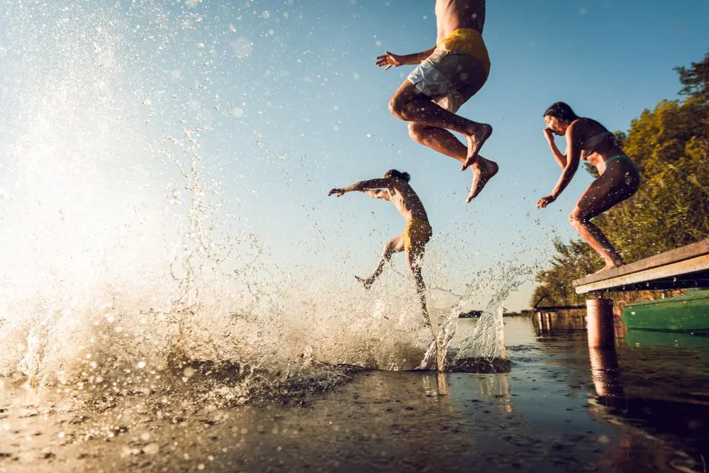 People jumping into water