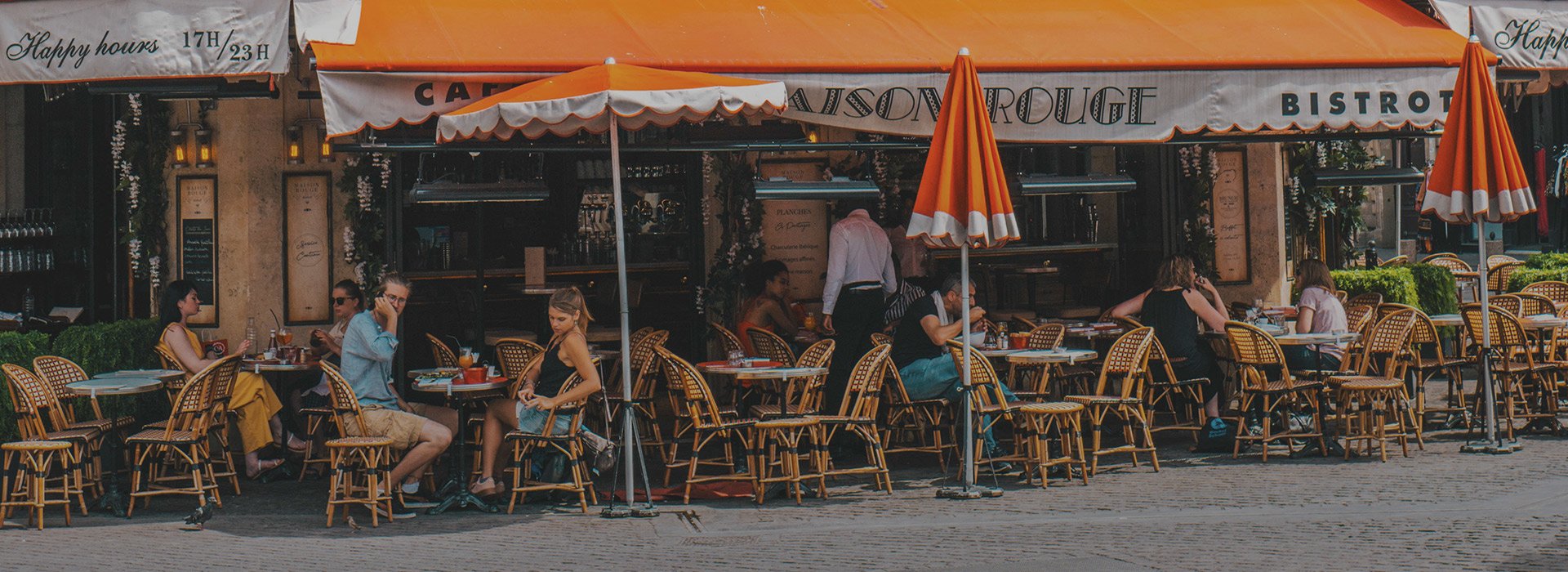 People sitting in front of the restaurant