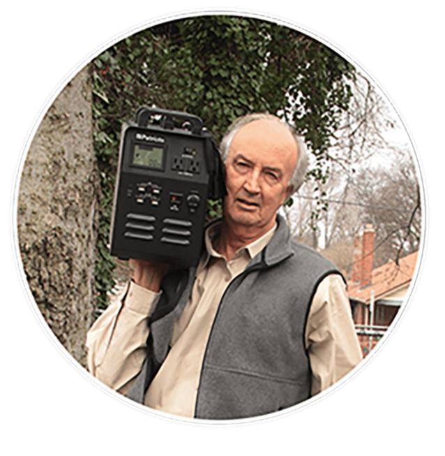 Older man holding Patriot Power Generator 