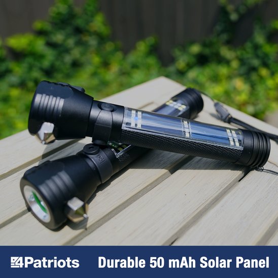 Two HaloXT Flashlights on an outdoor Table being charged by the built in solar panels