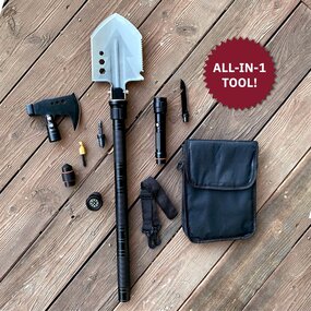 4Patriots CoyoteXT All-in-1 Tactical Shovel Kit laid on a wooden floor displaying its many uses including a shovel, axe, knife, compass, flashlight, firestarter, baton and screwdriver.