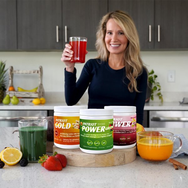 SunUp to SunDown Bundle on a countertop with each double size canister next to a glass of each supplement. Mindy in the background holding a glass of Patriot Power Reds.