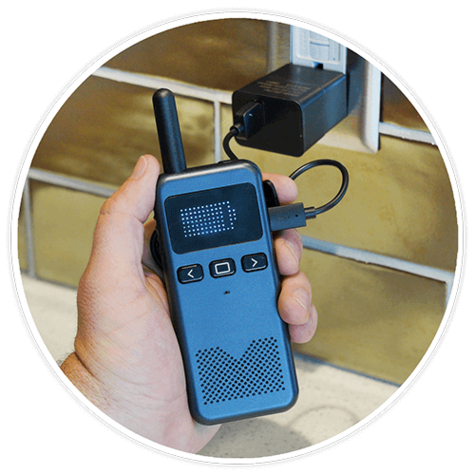 Talk-N-Go Rechargeable Walkie Talkie being charged with the USB and a wall outlet