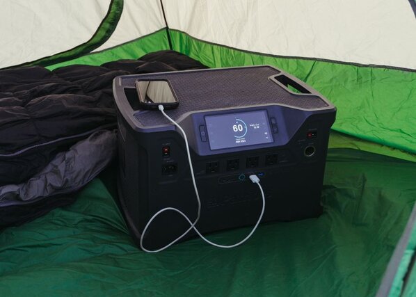 Patriot Power Generator 2000X charging a phone inside of a tent.