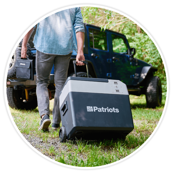 Man wheeling the 4Patriots Solar Go-Fridge