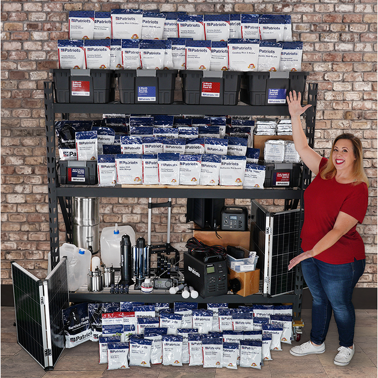 Woman displaying contents of Platinum 1-Year Survival Kit including power generators, water filtration systems, and survival food.